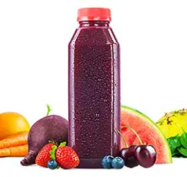 Purple juice bottle surrounded by strawberries, blue berries and watermelon