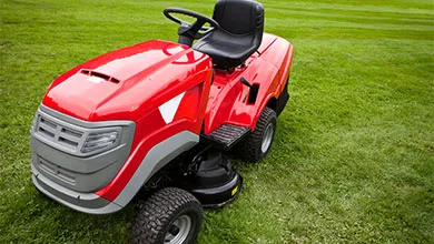 Red riding lawn mower
