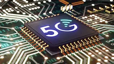 Close-up of a black computer chip, glowing blue 5G and Wi-Fi symbols, on a green circuit board with glowing pathways.