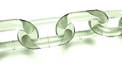 Close-up of interlocking, transparent glass-like chain links on a white background.
