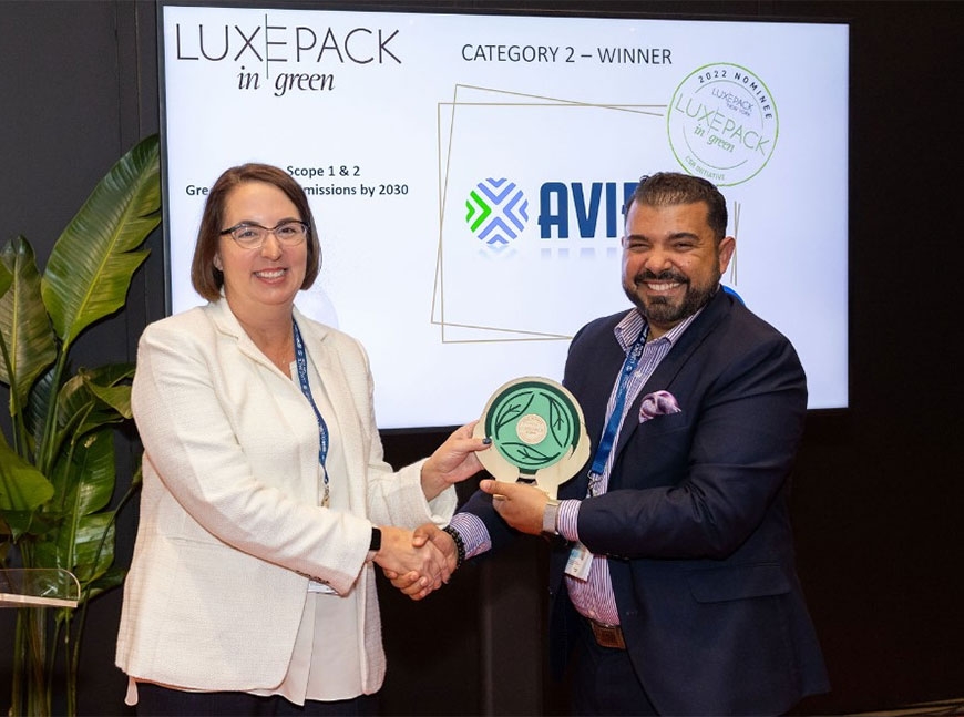 two people holding an award