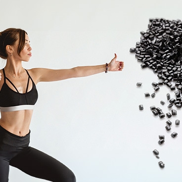 Female doing yoga and black pellets